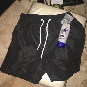 Swim wear shorts w/pockets & sunscreen bottle